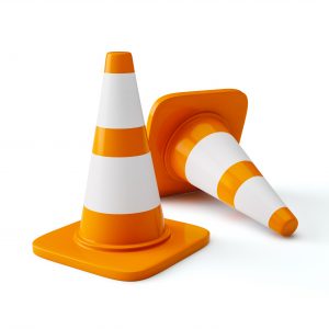 Under construction concept design background - orange highway traffic construction cones with white stripes isolated on white